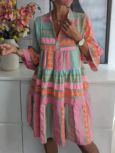 Robe Longue Mabel – Élégante avec décolleté en V et motif unique
